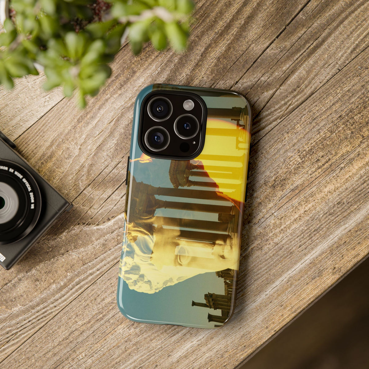 Augustus's Sun on Palmyra tough phone case by Vittorio Storaro, from the La Civiltà Romana collection, shown on a table