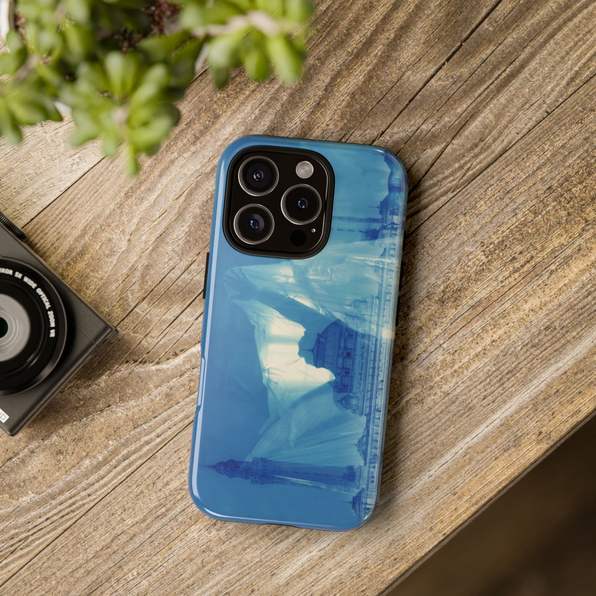 The Ideal City tough phone case by Vittorio Storaro, from the La Civiltà Romana collection, shown on a table