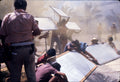 Crew holding reflector boards to shape sunlight on the Apocalypse Now set, behind-the-scenes photo