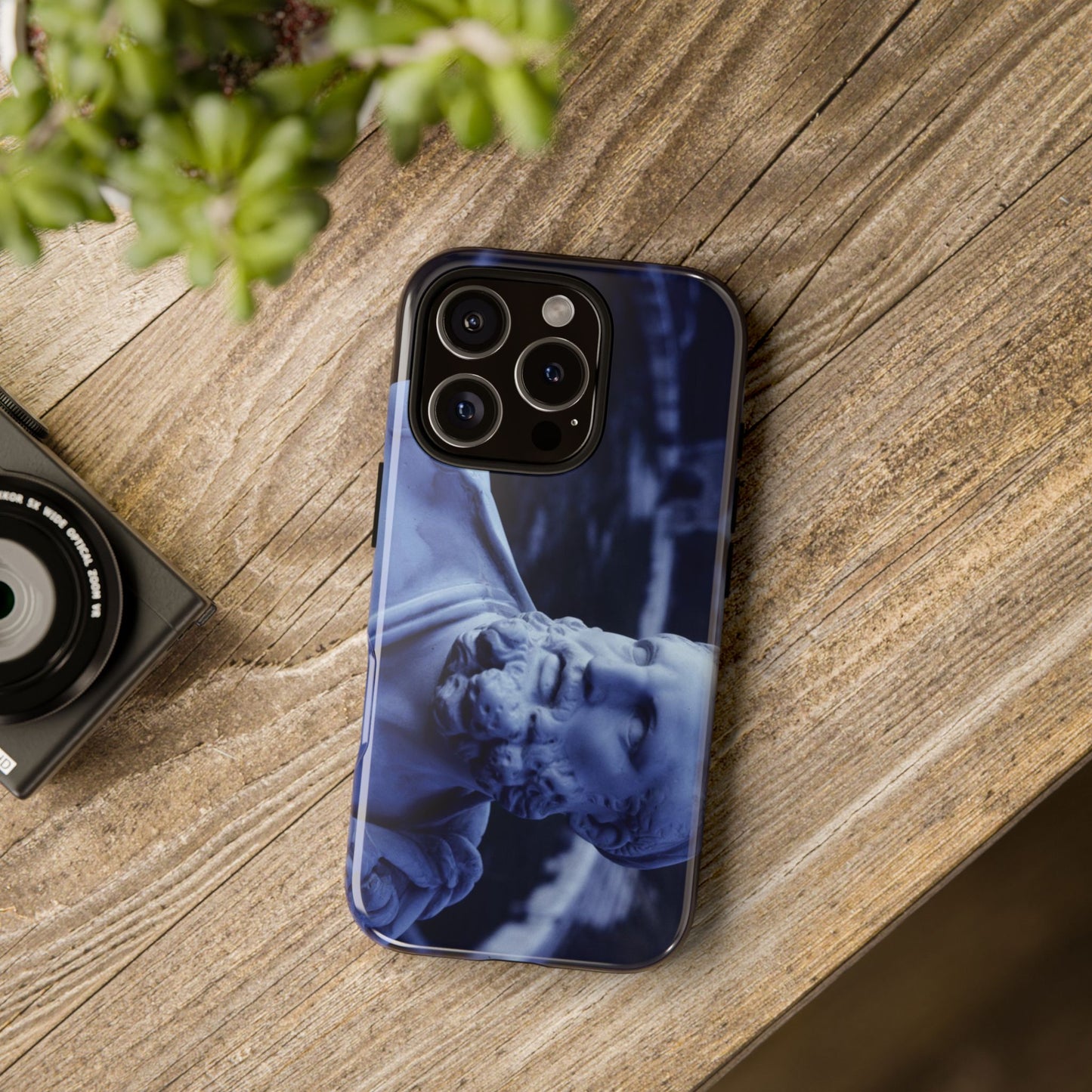 Eracle tough phone case by Vittorio Storaro, from the La Civiltà Romana collection, shown on a table